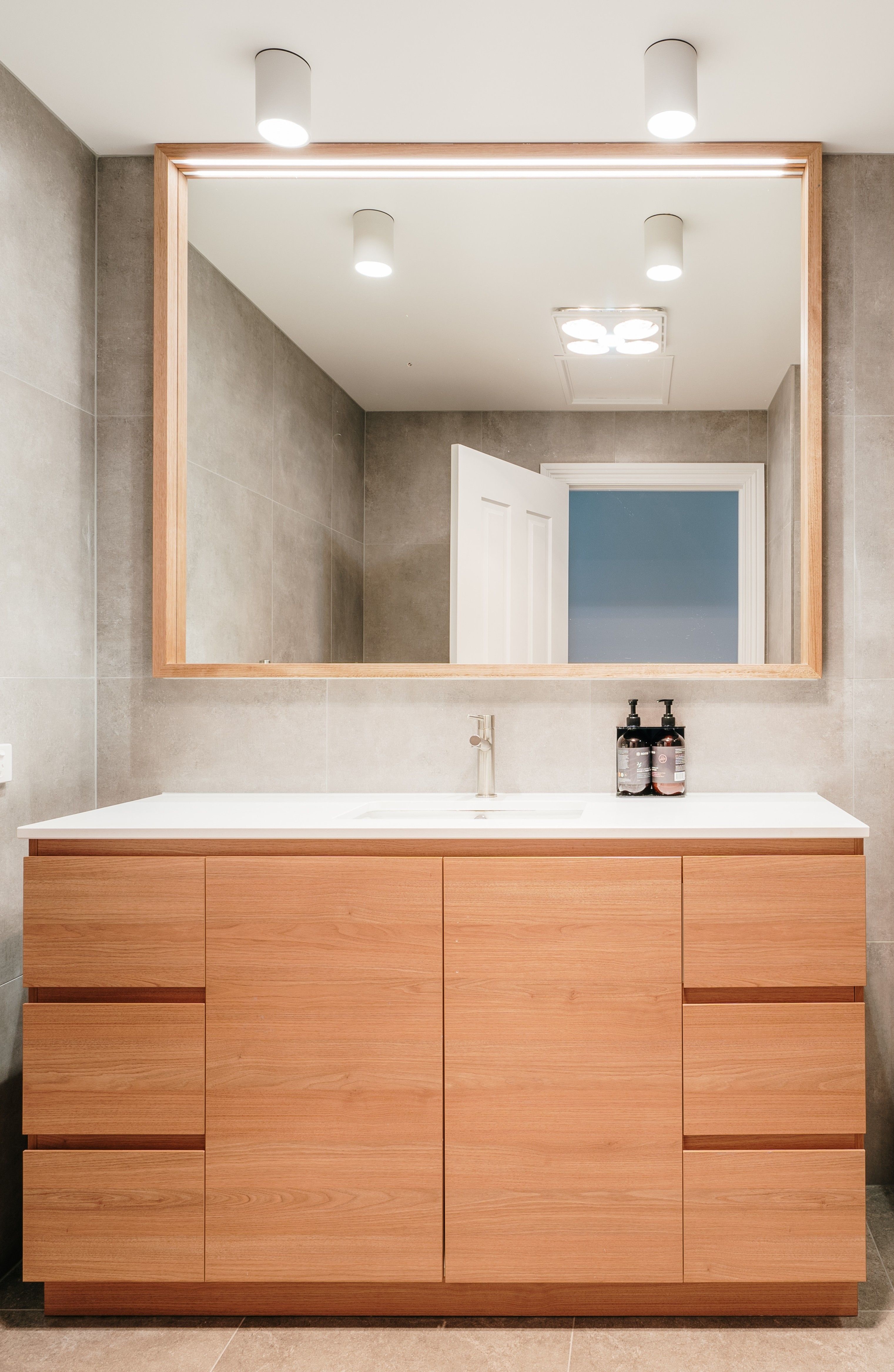 Refurbished Strahan Village bathroom vanity and shower detail